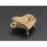 9K Yellow Gold Piano Charm. 1.29g