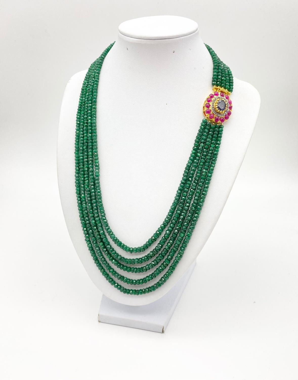 395cts Five-Row Emerald Necklace with Ruby and Sapphire Clasp. With a halo of Rose Cut Diamonds.