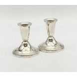 A PAIR OF SILVER CANDLESTICKS. 513gms 10cms a/f