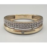 9K Yellow Gold Diamond set double row band ring, 0.30ct (approx.) Weighs 2.3g. Size O.
