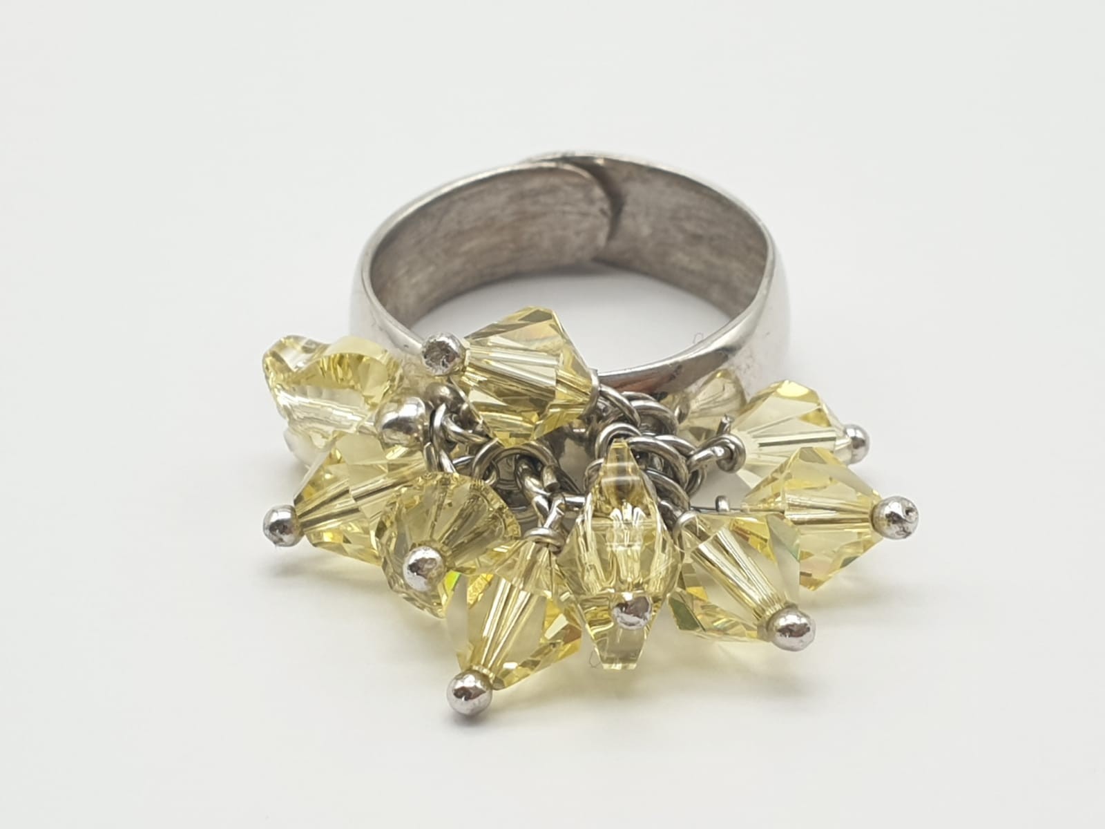 A Silver Ring with Multiple Miniature Yellow-Stone Attachments. Size P (expandable). 7.43g
