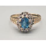 9K Yellow Gold Diamond and Topaz cluster ring. Size J 1/2 and weighs 1.6g.