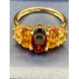 Ladies 9 carat GOLD and TOURMALINE ring ,having five stones mounted to top .Stunning piece of