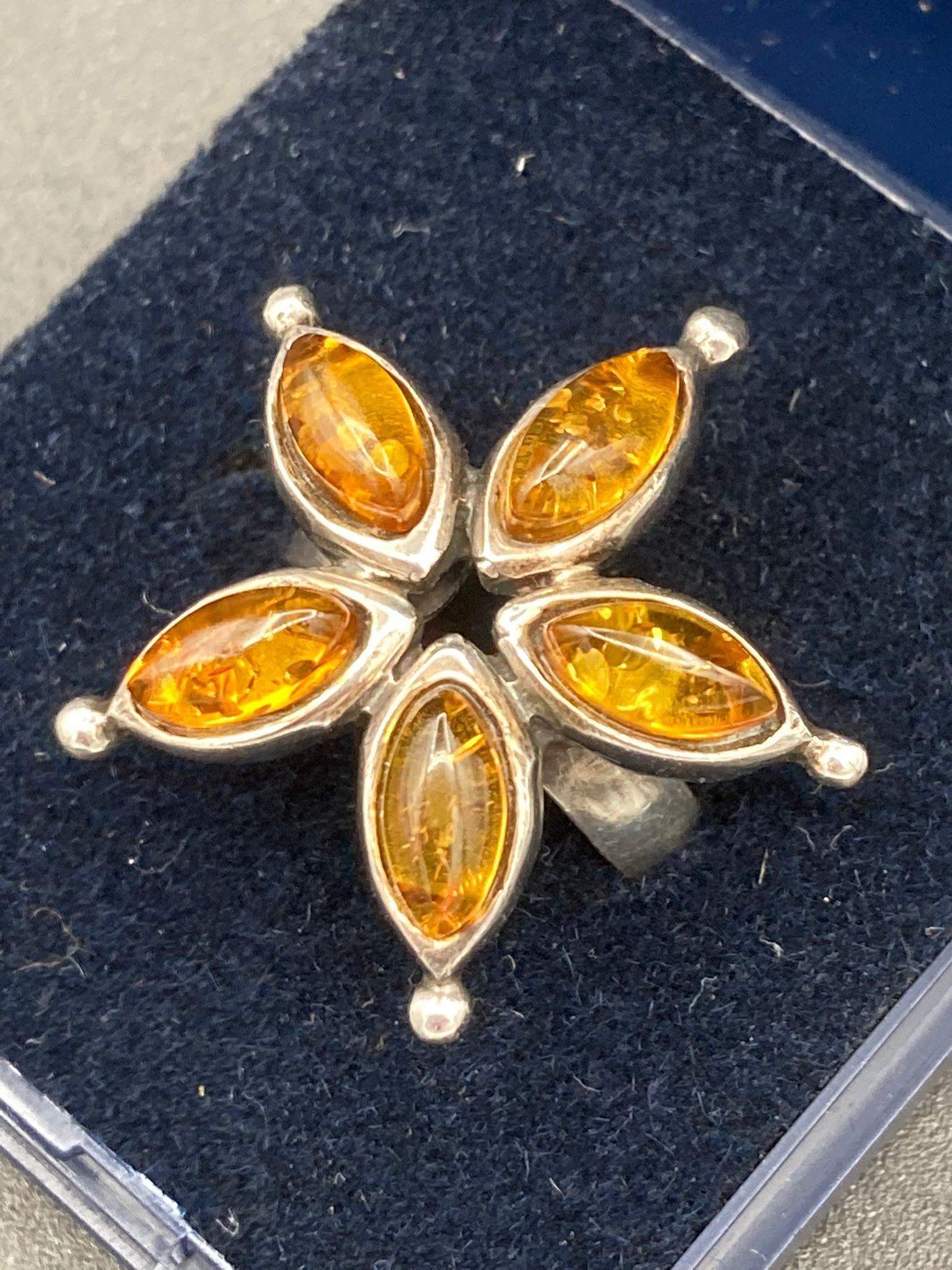 SILVER and AMBER ring in a five stone star formation. Size K.