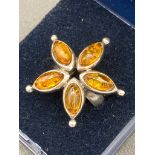 SILVER and AMBER ring in a five stone star formation. Size K.