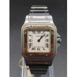 Santos de Cartier Oretacier watch, square face Roman numerals and two-tone (bi-metal) strap