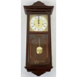 Mahogany Wall Clock with Key. In good very condition - appearance wise, but needs some mechanical
