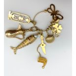 18k Yellow Gold Pendant with Multiple Charms. Some of the pendants are hallmarked 18K the others