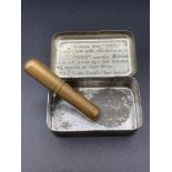 Vintage oxo cube tin circa 1935 containing an antique brass needle holder complete with needles.