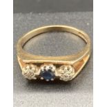 9 carat GOLD & SAPPHIRE ring in modern designer setting ,having small diamond to either side. 3.3