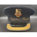 A VINTAGE BRITISH RAILWAYS STATION MASTERS CAP WITH BADGE AND BRAIDING.