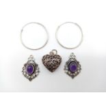 A Pair of Silver Hoop Earrings and Three Silver Pendants. One Heart shaped and Two with Purple