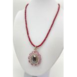 135cts of Ruby in a Pendant with Black Pear Moissanite. Surrounded by halo of diamonds in sterling