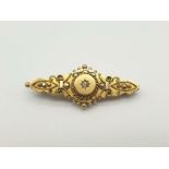 A 15K Yellow Gold Diamond Brooch with Ornate Decoration. 4cm. 4.65g