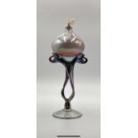 A stylish, hand blown, incandescent glass, artisan's oil lamp. Height 23cm.