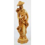 A 38cms TALL ORIENTAL FIGURE NICELY CRAFTED IN RESIN. 1.67kg
