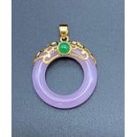 A Circular Lavender and Jade Pendant.