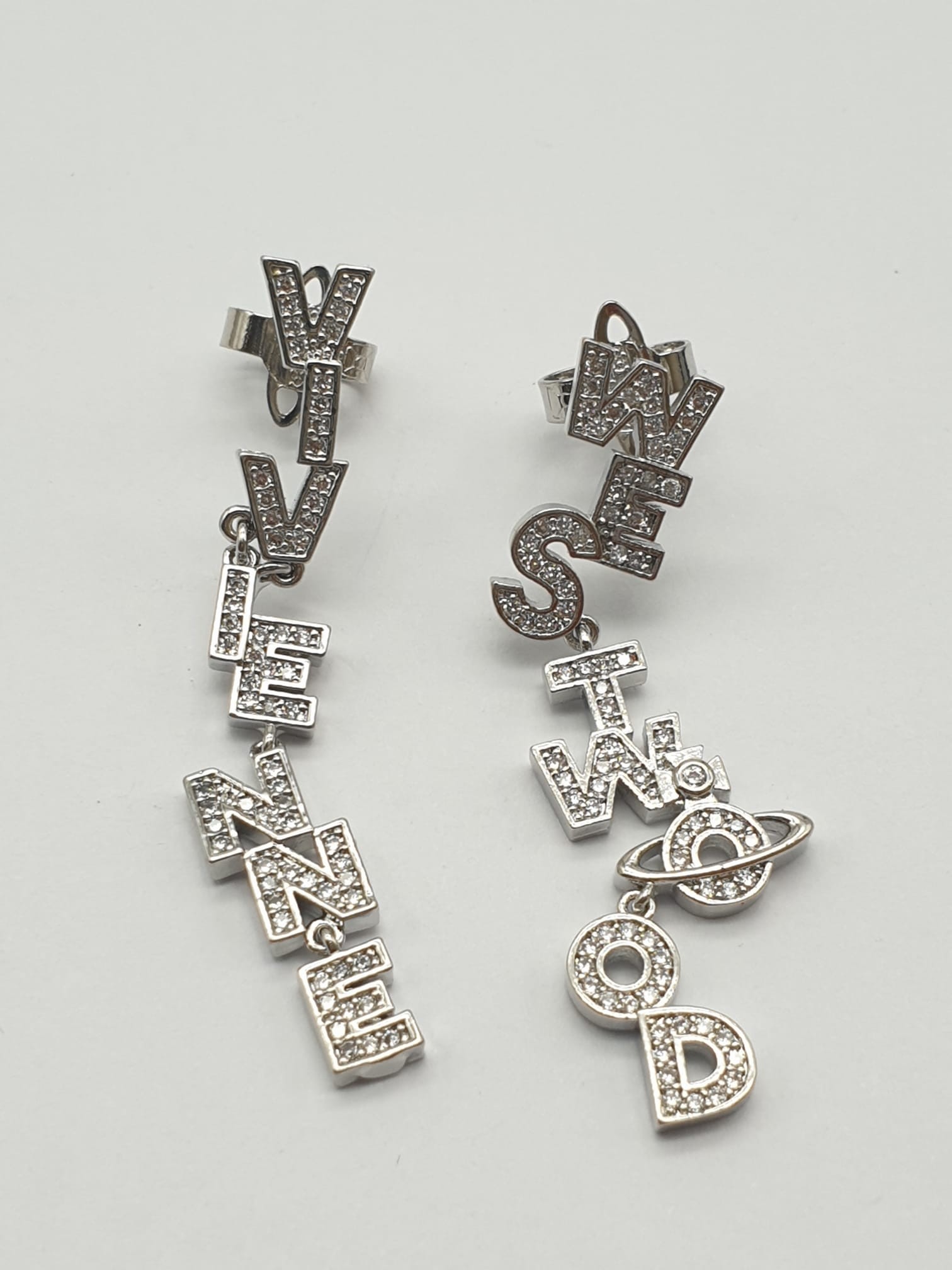 A pair of designer earrings by the iconic British designer Vivienne Westwood. Cast in silver tone