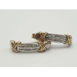 A Pair of 18K Yellow and White Gold Half-Hoop Earrings with Encrusted Diamond Decoration. 4.28g