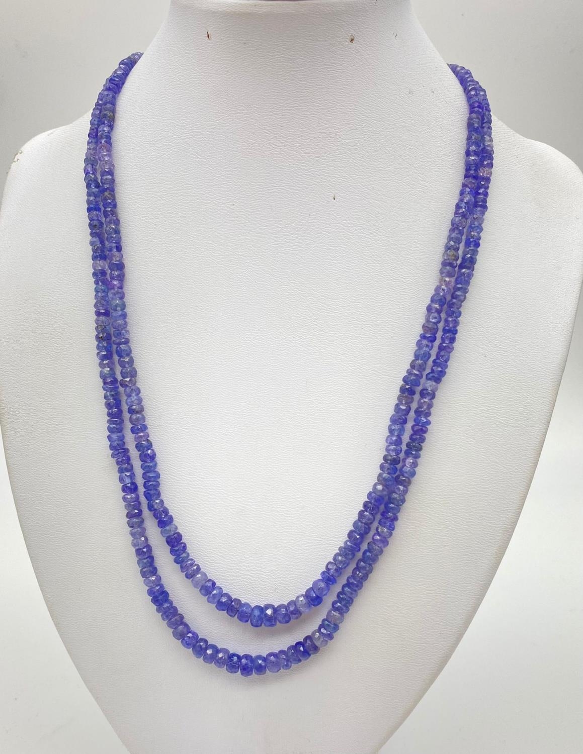 200cts Two-Row Tanzanite Gemstone Necklace with Emerald clasp circled with a halo of diamonds. 46cm