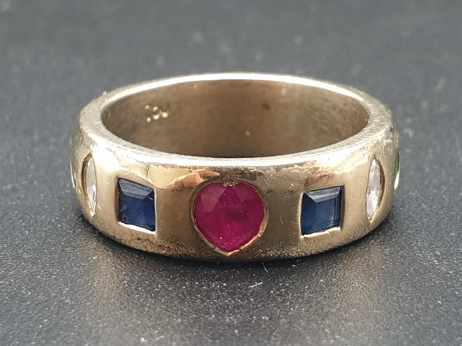 18K Yellow Gold Diamond, Ruby, Sapphire and Emerald band ring. Weighs 9.5g and Size M. 0.16ct
