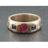 18K Yellow Gold Diamond, Ruby, Sapphire and Emerald band ring. Weighs 9.5g and Size M. 0.16ct