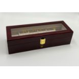 A Rolex six watch display box with shutter-proof glass and highly polished veneer. Ideal for