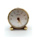 A VINTAGE MINI TRAVEL ALARM CLOCK MADE BY LOOPING. 4.5cms tall.