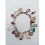 A Silver Charm Bracelet with Fifteen Charms. 20cm. 26.5g