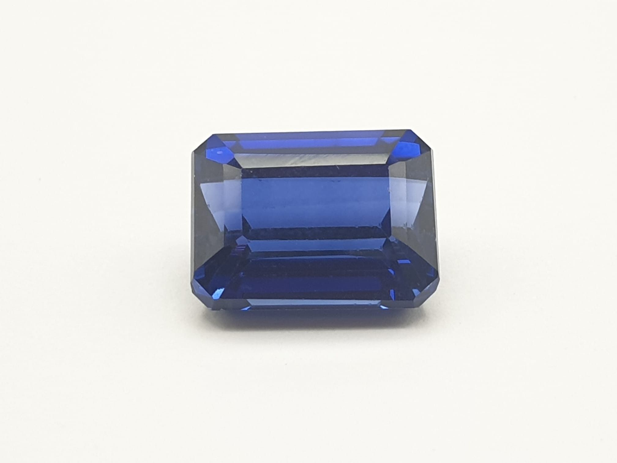 A perfect, for the serious jeweller, or refined collector, emerald cut, dark royal blue sapphire