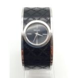 DKNY Ladies Dress Watch. Black Monogramed Leather on Stainless Steel Strap. Black Dial. As found.