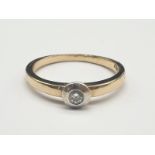 14K Yellow Gold Diamond Rub-over Solitaire Ring. 0.10 Carat. 3.2g. Size O.