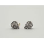 A Pair of Yellow and White Gold Diamond Encrusted Heart-Shaped Stud Earrings. 1.27g