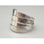 Sterling Silver 4 Row Fancy Ring. Size I and weighs 6.4g.