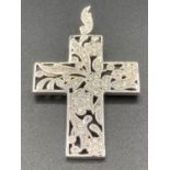 Beautiful jewelled silver cross having stunning and intricate detailed design. 5 cm x 3.2 cm.
