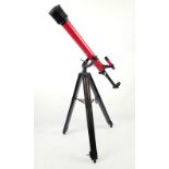 A TASCO 58T TELESCOPE ON TRIPOD AND HAVING AN ERECTING EYEPIECE