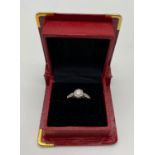 A VINTAGE 18K GOLD DIAMOND RING WITH .25CT DIAMOND SET IN PLATINUM. 2.8gms size N