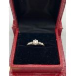 A VINTAGE 18K GOLD DIAMOND RING WITH A .15 DIAMOND SET IN A PLATINUM ILLUSION SETTING. 2.3gms size N