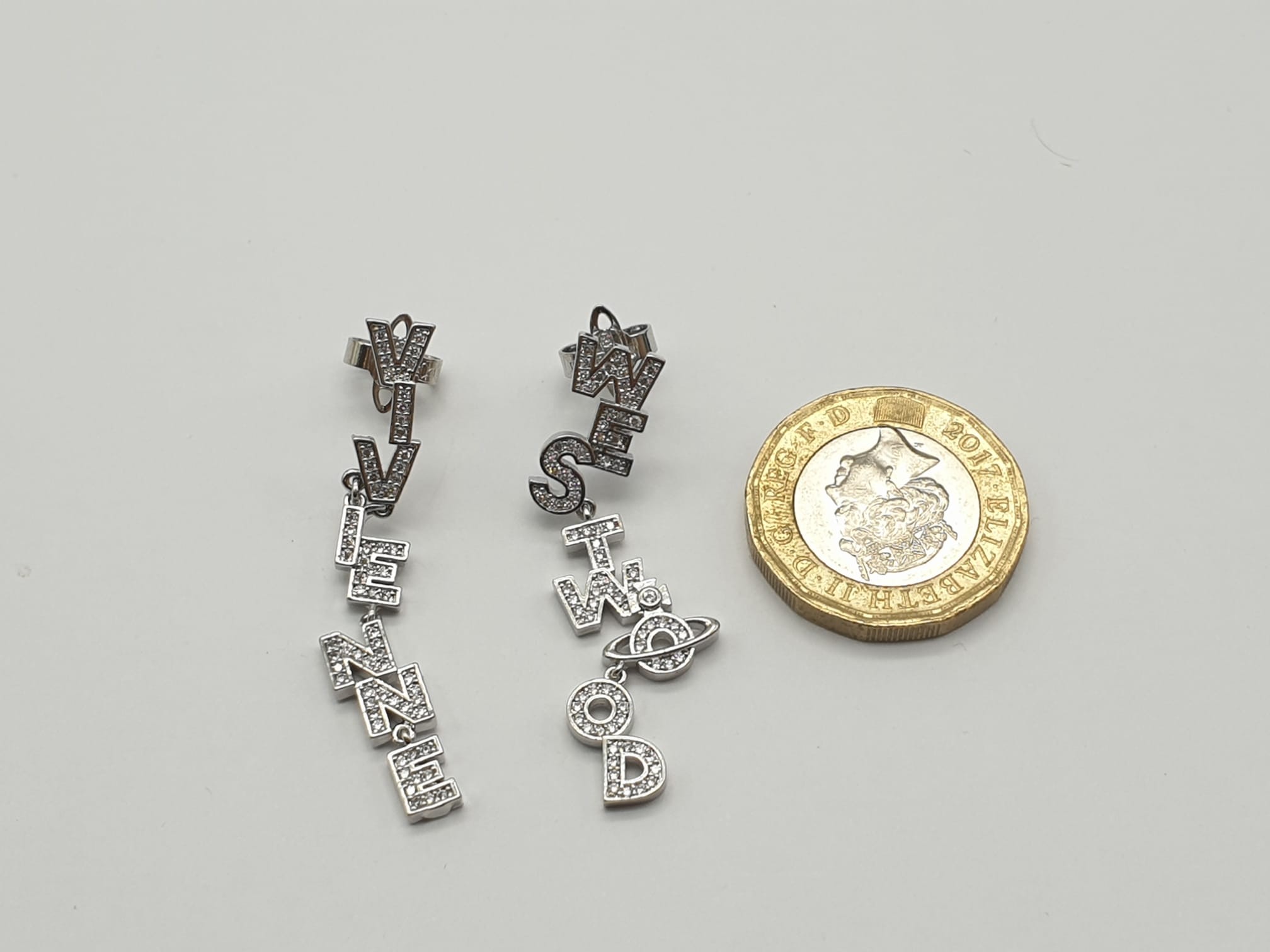 A pair of designer earrings by the iconic British designer Vivienne Westwood. Cast in silver tone - Image 3 of 4