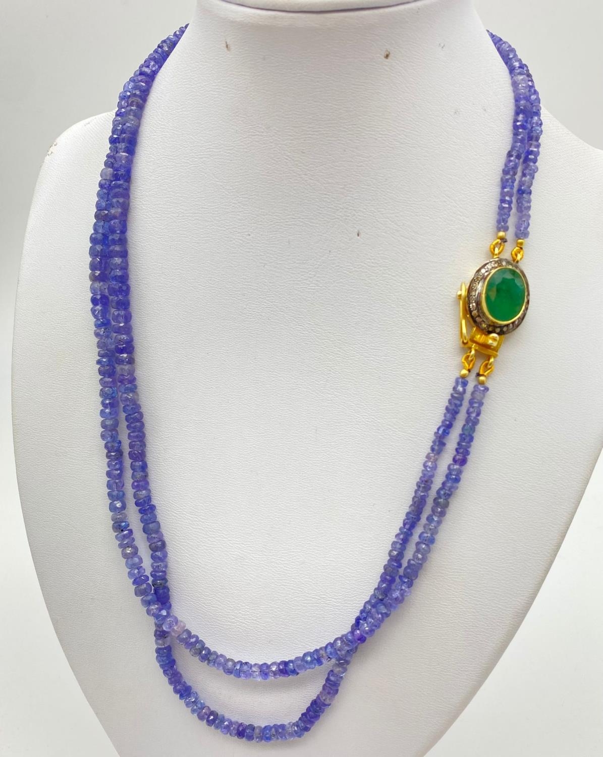 200cts Two-Row Tanzanite Gemstone Necklace with Emerald clasp circled with a halo of diamonds. 46cm - Image 2 of 3