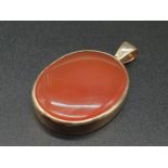 a good size 9k gold pendant with carnelian centre. 11.5gms 3 x 2.3cms "