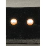 Pair of silver and ? pearl ?earrings . Marking for silver presented in an attractive gift box.