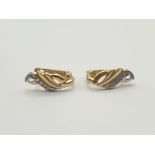 Pair of 14k Yellow Gold and Diamond Earrings in a Leaf Design. 2.92g