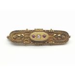 A 15K Yellow Gold Diamond and Ruby Brooch. 4cm. 3.6g