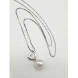 Sterling Silver Heart and Pearl Necklace. 18 inch length in presentation box.