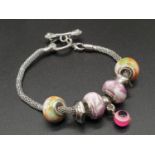 A PANDORA STYLE BRACELET IN WHITE METAL 16gms 20cms