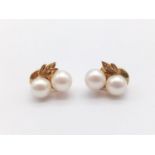 A Pair of Yellow Gold and Double-Pearl Earrings. 3.25g