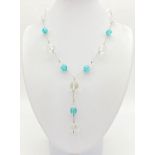 Sterling silver clear and aquamarine colour crystal beaded necklace. Length 40.64 cm.