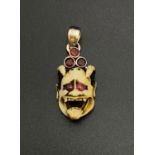 Meiji Period Carved Devil with Ruby and Garnet Silver Pendant.