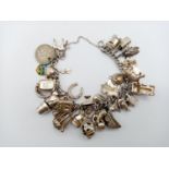 Silver Bracelet with over Thirty Charms! 22cms 73g total weight.